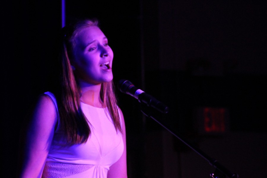 Freshman Ellen Kester sings during MS Benefit Concert put on by Senior Beckie Walker