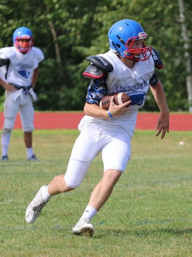 Senior quarterback Bobby McEachern runs the ball during a preseason game, prior to his injury.