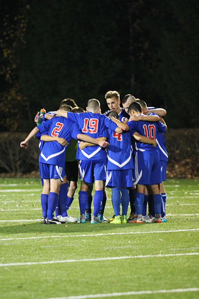 The boys meet in what could have been their last team huddle before entering the second round of overtime.