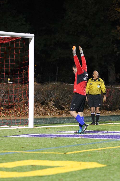 Junior goalie Cam Wheeler prepares to block the final penalty kick which will win the game for the Lancers.