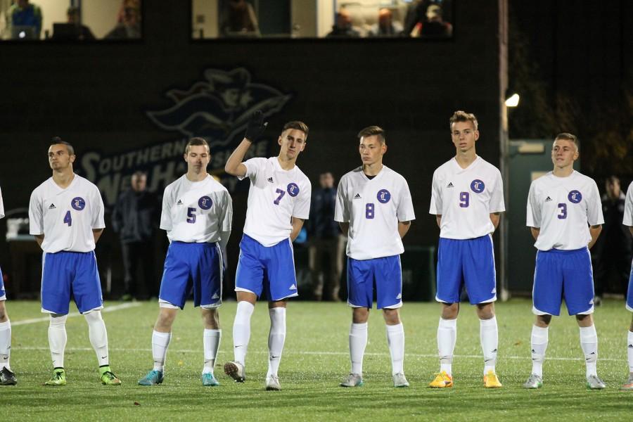 Senior Griffin Cowles waves to the crowd at his championship soccer game. Cowles, Nate Gaw, number 4, and Nick Vanini, number 9, all made all-state teams.