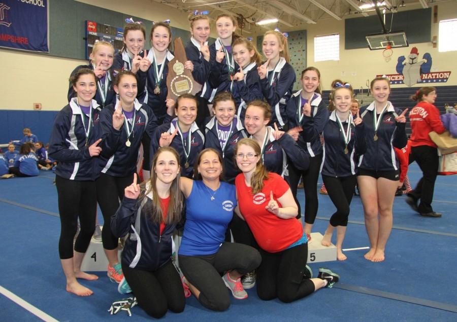 Gymnastics celebrate winning the state championship.