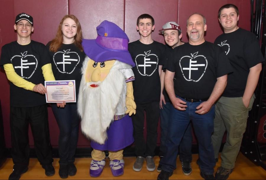 Five Guys, left to right, coach Craig Plevinsky, junior Julia Fitzgibbons, senior Evan Plevinsky, sophomore Trevor Malanson, coach Eric Malanson, and senior Duncan Campbell, won their Improv challenge last March 19.