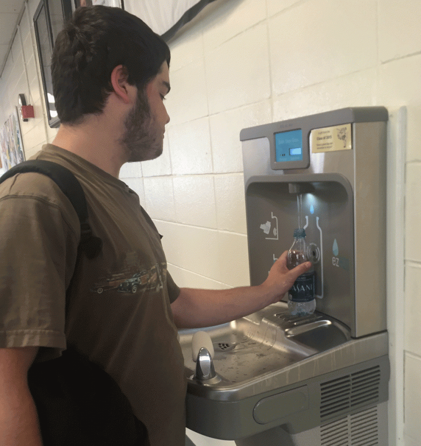 Rather than having to buy a new bottle of water each time he finishes one, sophomore Matt Olsen is able to help cut down on waste by refilling the same bottle at the hydration station in the lobby.  