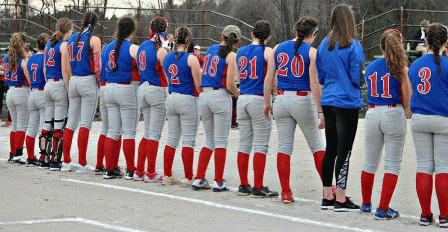 Lisa Nelson, who players consider their Team mom, captures the girls softball team at their Concord game on April 18.  LHS defeated CHS 3-1.