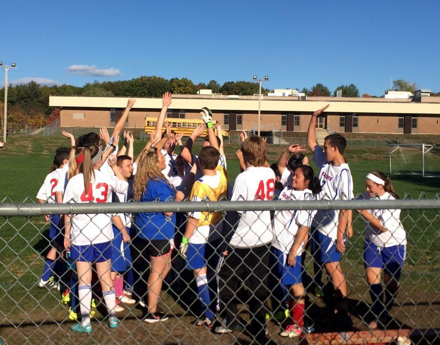 Unified Soccer celebrates their senior night victory. 