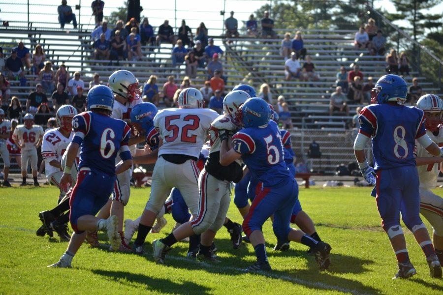The Lancers defense battles against the Pinkerton offenders to bring down the ball carrier. The Lancers topped their rivals 42-20. 