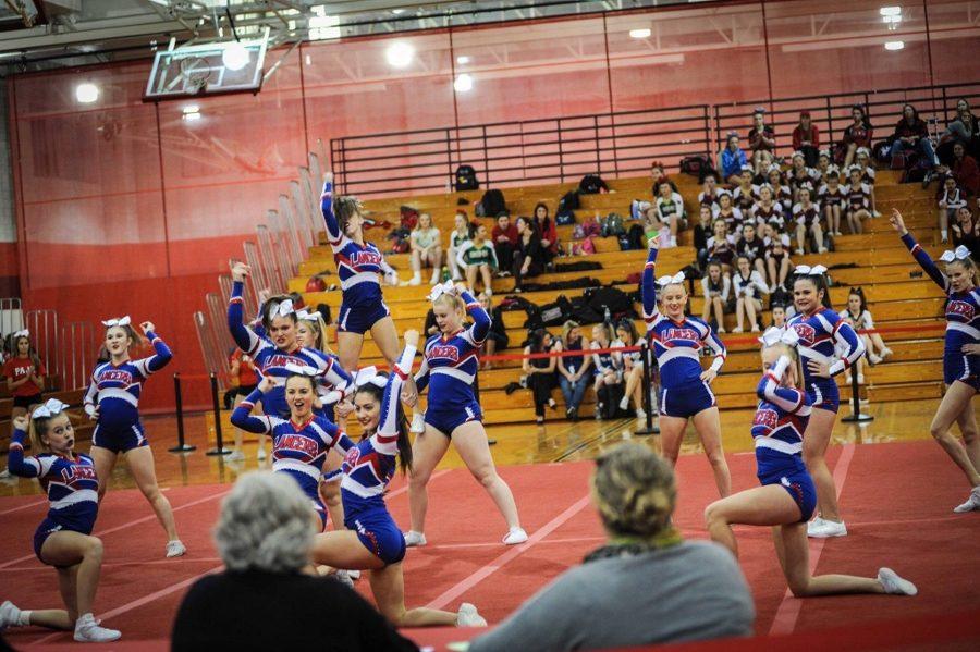 After jumping, stunting and tumbling for two minutes thirty seconds the girls hit the final pose of the routine.