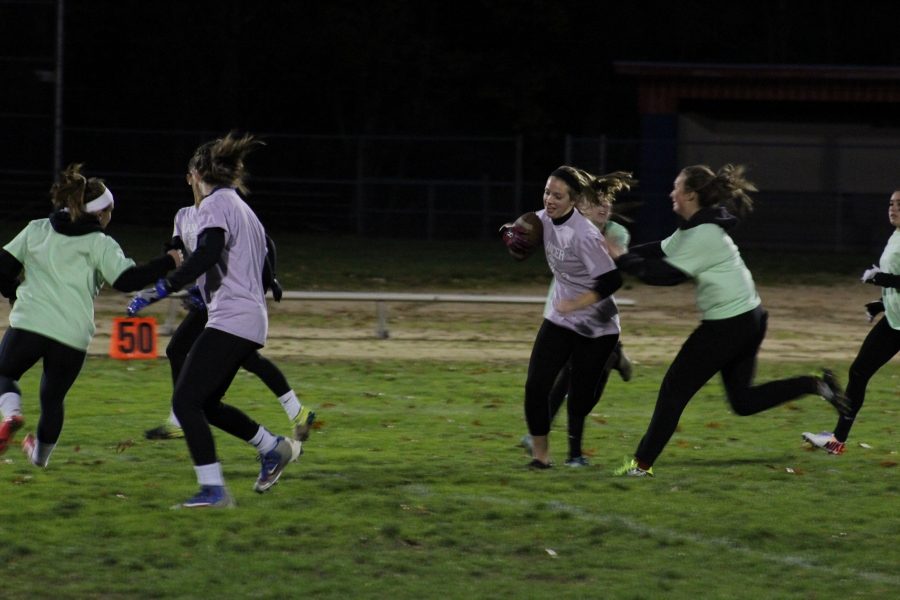 Sophomore Samantha LeClair tries to avoid junior Jill McNeil in the teams game. 