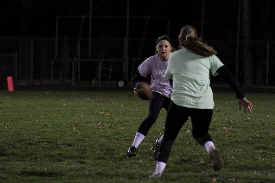 Sophomore Emily Dumaresq looks to deke a junior defender. 