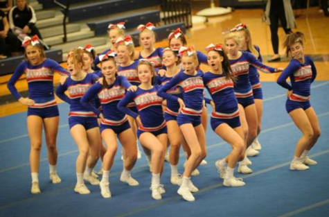 The cheerleaders dance it out to “Circus” by Britney Spears, which is the last element in the routine. The dance is around 35 seconds long or 5 eight counts. This may not seem long, but after stunts, jumps, and tumbling, the cheerleaders are exhausted by the end of the routine. 