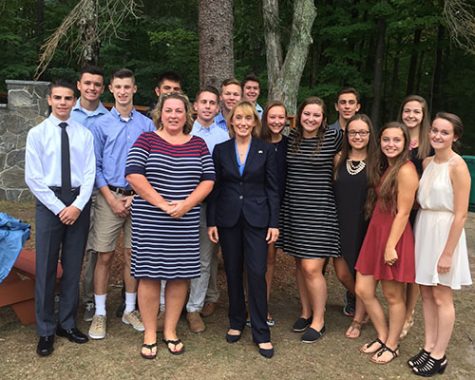 The Pay-it-Forward club meeting governor Maggie Hassan at a 9/11 memorial to pay respects to those who have fallen in the line of duty. Left to right: sophomore Blake Melnik, junior Jake Parilla, senior Nick Salcito, senior Nick Scarfo, senior Brian Frechette, senior Merril Neiman, senior Dominick Federico, senior Annika Lidster, junior Caroline Russell, sophomore Josh Galluzzo, senior Allie Whitehead, senior Valary Shay, senior Erika Tsetsilas, and junior Maeve McPhial Front: Assistant Principal Ms.Sullivan and Governor Maggie Hassen 