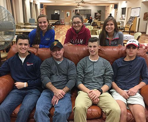 The Pay-it-Forward club plays bingo with veterans at the VA hospital at their annual event.
Top left to right: sophomore Abby Cowles, freshman Sydney Olin, sophomore Abby Follansbee
Bottom left to right: junior Jake Parilla, a veteran, senior Nick Salcito and sophomore Blake Melnik