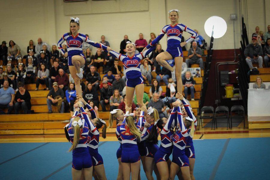 The varsity cheerleaders build a pyramid as part of the routine they perform at pep rallies.  This is one of the stunts they will perform at the States competition to take place this Sunday at Pinkerton.