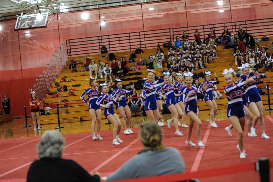 The girls get ready for one of the most tiring parts of the routine, tumbling.