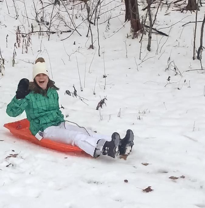 junior Lauren Misiaszek sleds at Macks Apples