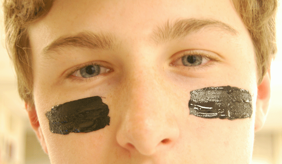 Sophomore Jimmy Fitzgibbons sports striped eye-black to prepare for game day.