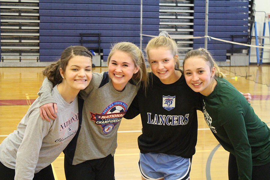 From left to right: Katie Sullivan, Olivia Stowell, Gwen Barnes, and Gia Komst pose together after their match. 