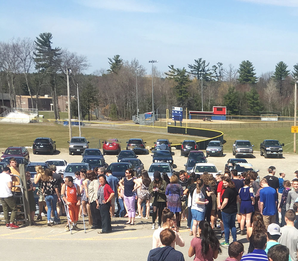 Students filing into the plateau parking lot during the most recent fire drill.