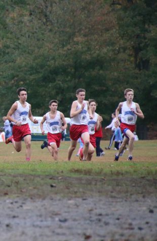 The cross country team boys running in the Brown Invitational last year.