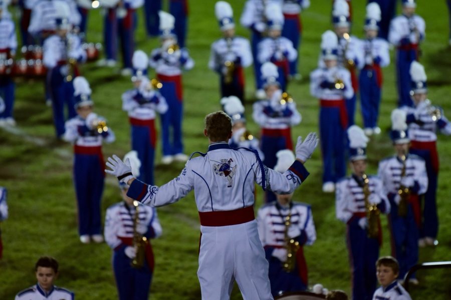 Junior Drum Major Ian Goodspeed directs the  band at the Salem Band Show 