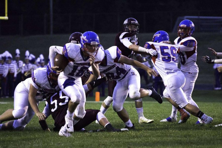 Junior Ty Belville (59) waits patiently at offensive guard to drive into a tackle against Timberlanes defensive line. Picture is from last year because it is was the last time he played in a game previous to his injury.