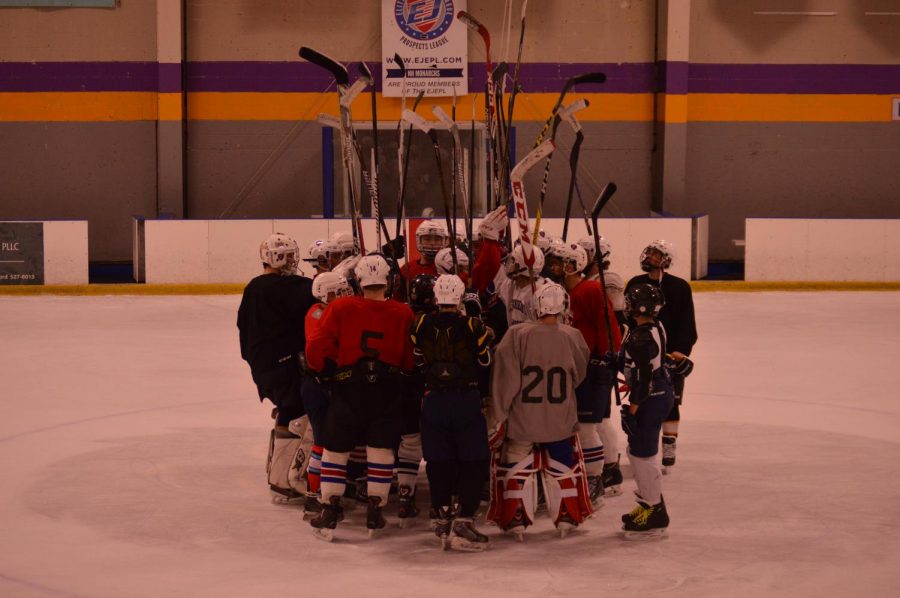 Captain Jared Tuccolo calls a team huddle after a captains practice on October 19, 2017 .