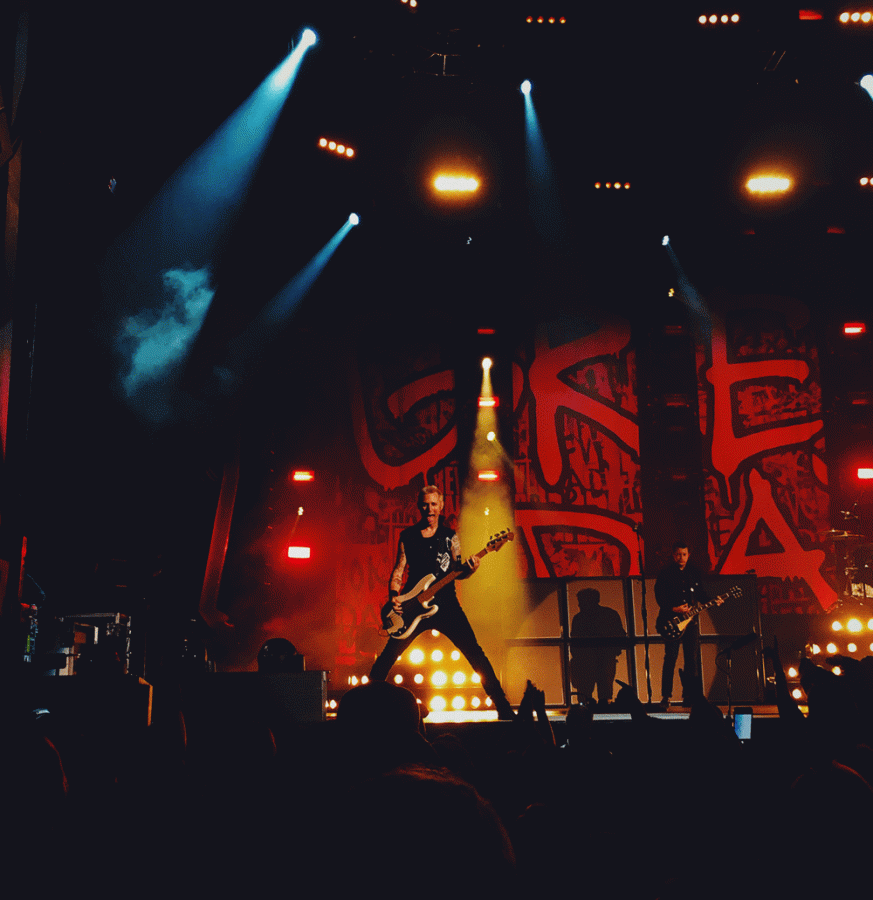 Green Day Bassist Mike Dirnt sticks out his tongue at the crowd during the Buffalo show of their Revolution Radio tour. The Revolution Radio tour began on September 26, 2016, and ran through November 19, 2017. 