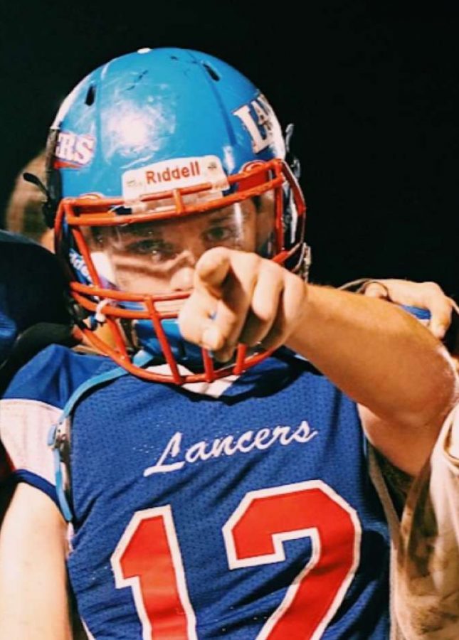 Sophomore running back Jeff Wiedenfeld poses for the camera after winning 26-21 against Nashua North. This started was the third win of the season that propelled them to a 3-0 record.