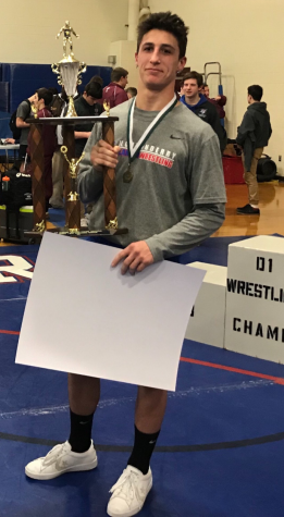 Senior wrestler comes in first place at NHIAA D1 championship