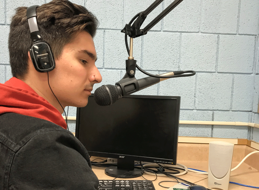 Zach Ford records a podcast during Radio Club.