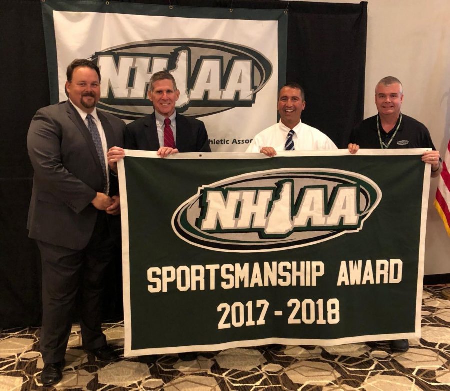 Mr. Parent and Mr. Sobolov accept the NHIAA award.