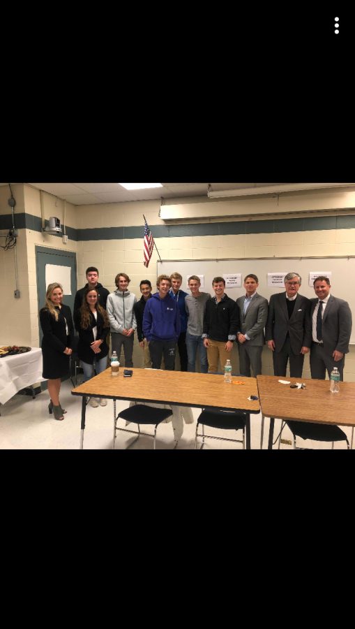 Ap Government students gather with the lawyers and former Supreme Court Justice of N.H. after participating in their discussion. 