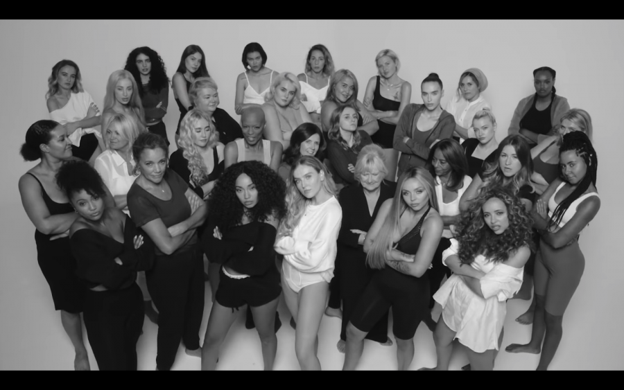(From left to right) Leigh-Anne Pinnock, Perrie Edwards, Jesy Nelson, and Jade Thirlwall pose for the "Strip" music video. The music video was released on Nov. 16, 2018, and features rapper Sharaya J (pictured behind Pinnock).
