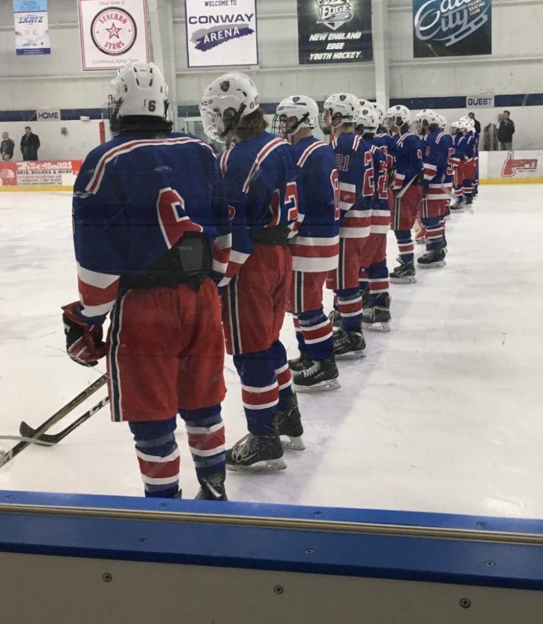 The Lancers prepare for gametime in unity at the blue line. 