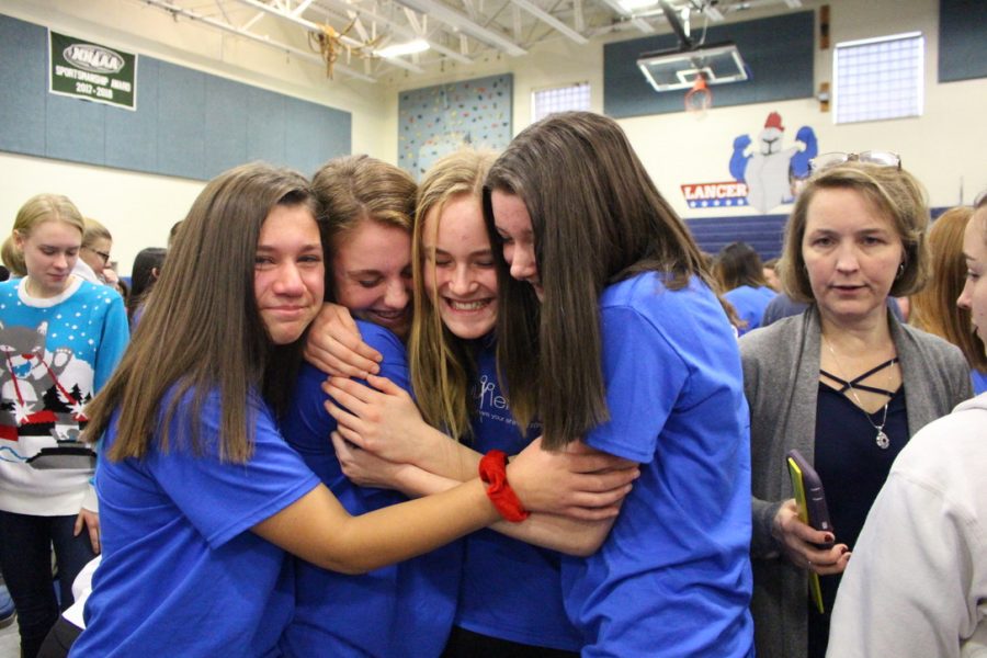 The Day of Giving is a  ceremony held each year at LHS. It's a day to commemorate the generosity of the Londonderry community as well as a way to support those who volunteered to donate their hair to help make wigs for those with cancer .
