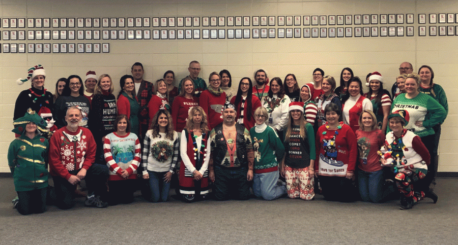 Teachers share their holiday cheer by wearing ugly sweaters or other festive attire during todays annual Holiday Sweater Day.  