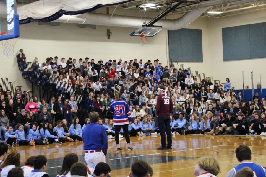 Student Council President Harry Feig and senior class President Liz Iaconis address Lancers during the winter 2019 pep rally.