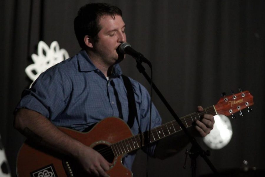 Mr. Roop jams out on his guitar at the Teacher Talent Show two years ago.