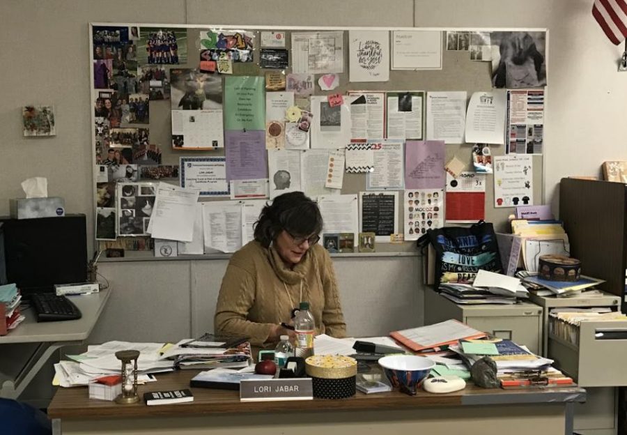 Jabar works tirelessly sorting through students tests and homework trying to help them organize. You can peek into her room any day  and you will see her working hard. 