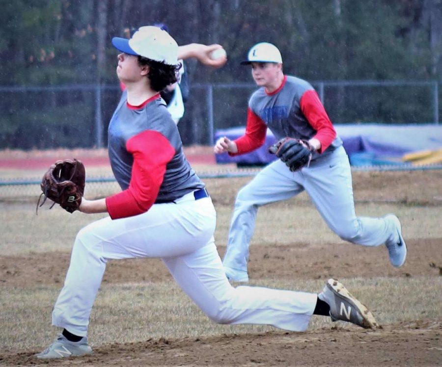 Manor extends forward as he hurls the ball towards home in their Connecticut tournament.