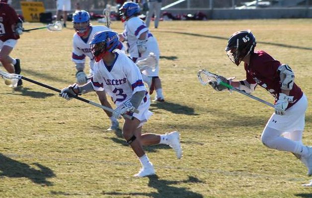 Fougere races from the defender as he cradles the ball up the field.