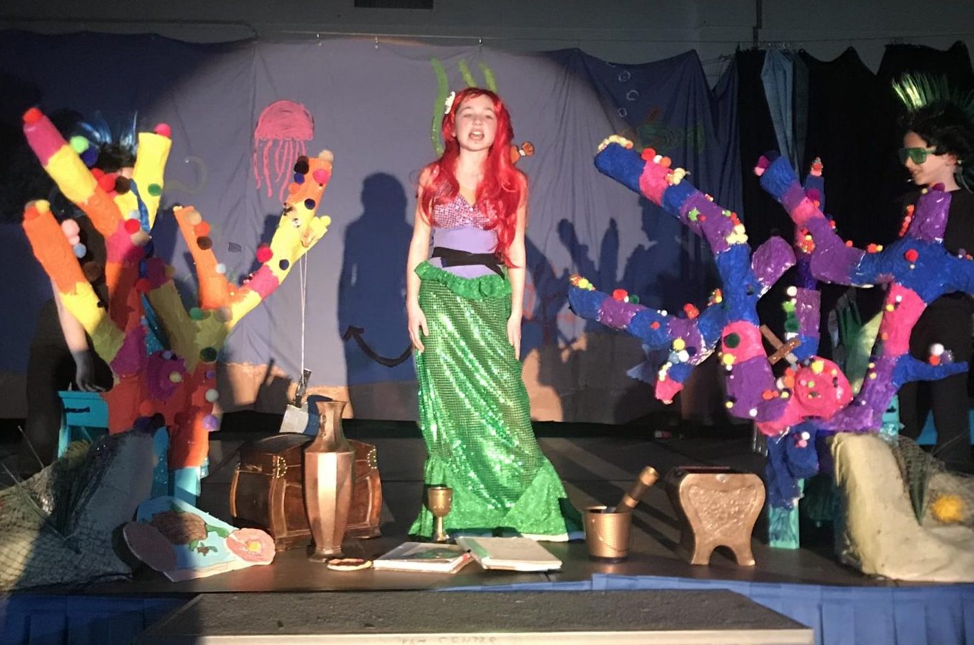 Lead role Jillian Willwerth sings “Part of Your World” surrounded by props crafted by the Scenery Crew. The song is one of many Willwerth’s voice is featured in.