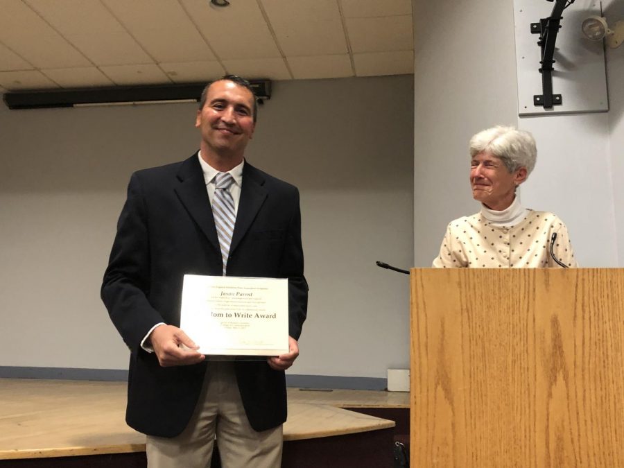 Principal Jason Parent receives the Freedom to Write Award at today’s New England Scholastic Press Association conference at Boston University. This award is given to a principal in New England, who shows extraordinary support to the journalism program at their school. NESPA’s Executive Director Helen Smith introduced Parent before presenting him with the award and shared specific details from the nomination letter that journalism adviser Mary DeWinkeleer wrote. 