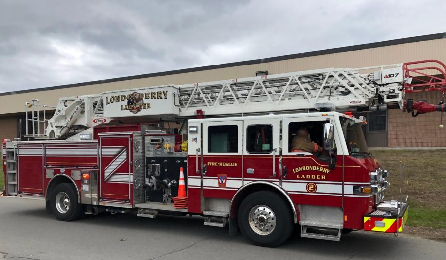 A firetruck speeds into the LHS parking lot. Firefighters quickly assessed the situation and found no sign of flames or heat. 

