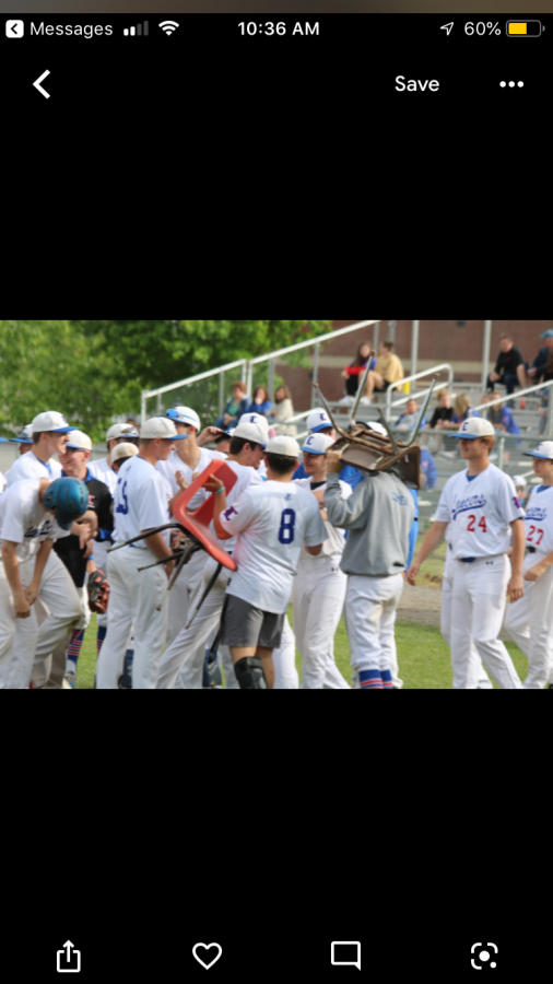 The team conversose after Junior Nolan Lincoln strikes out the side in their first playoff game vs. Spaulding. 