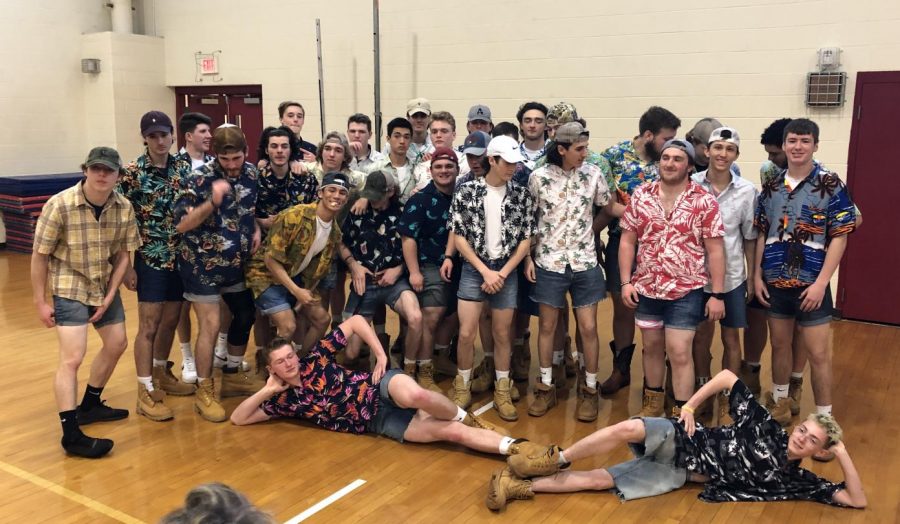 The lacrosse boys wear Hawaiian shirts as part of their skit during the spring pep rally.
