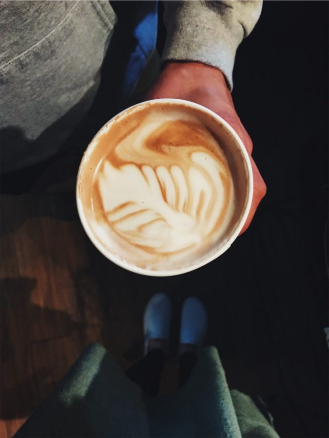 The pumpkin spice latte from The Grind Rail Trail Cafe in Derry, NH, is served with fancy designs.