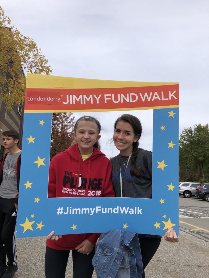 Juniors Delaney Kearns and Katherine Marshall take a picture before participating in the Jimmy Fund Walk. 