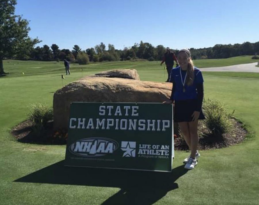 Riley Anderson poses with her state championship medal at Campbell’s Scottish Highlands Golf Course in Salem, New Hampshire. Anderson shot a 38 beating her nearest opponent by six strokes.
